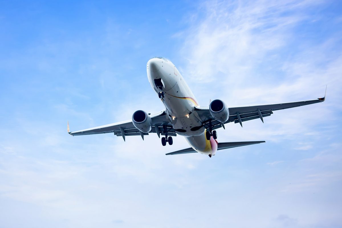 An airliner in flight, seen from below